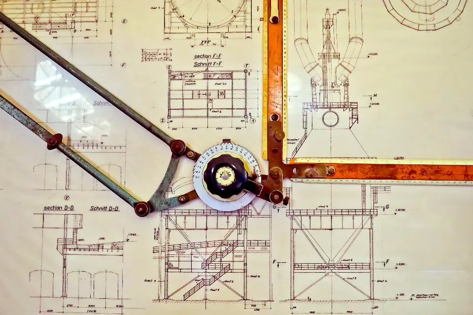 Technical drawings and measurements on blueprint paper