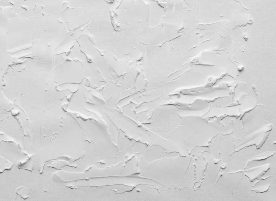Close-up of a white textured plaster wall